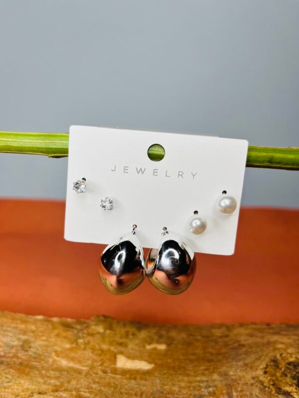 a pair of earrings on a stick