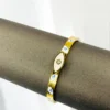 Gold Evil Eye Cuff Bracelet with White Enamel - Image 5
