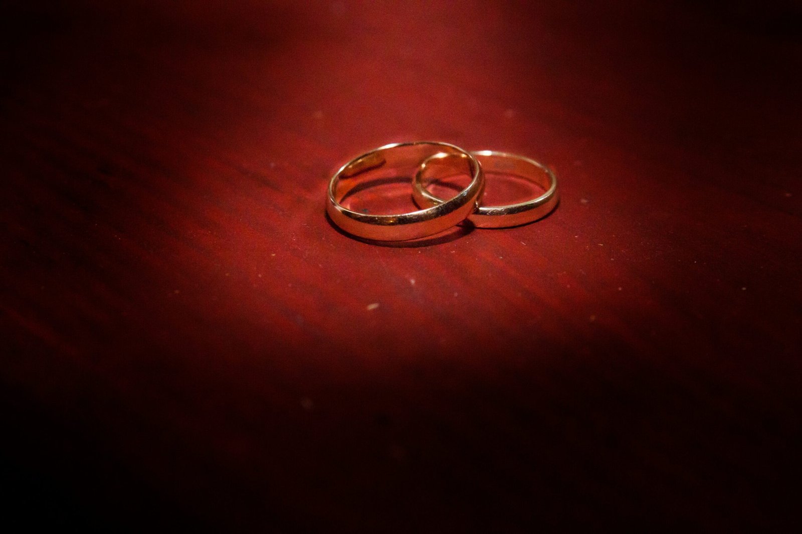silver ring on brown wooden table